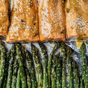 tahini ginger salmon on a sheet pan with sesame asparagus