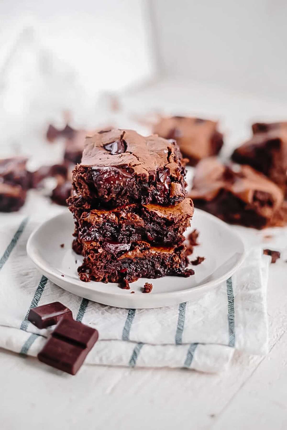 fudgy chocolate paleo brownies cut into large squares on a serving dish