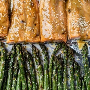 ginger salmon on a sheet pan with roasted sesame asparagus
