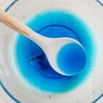 blue jello dissolved in a bowl with cold water and vodka