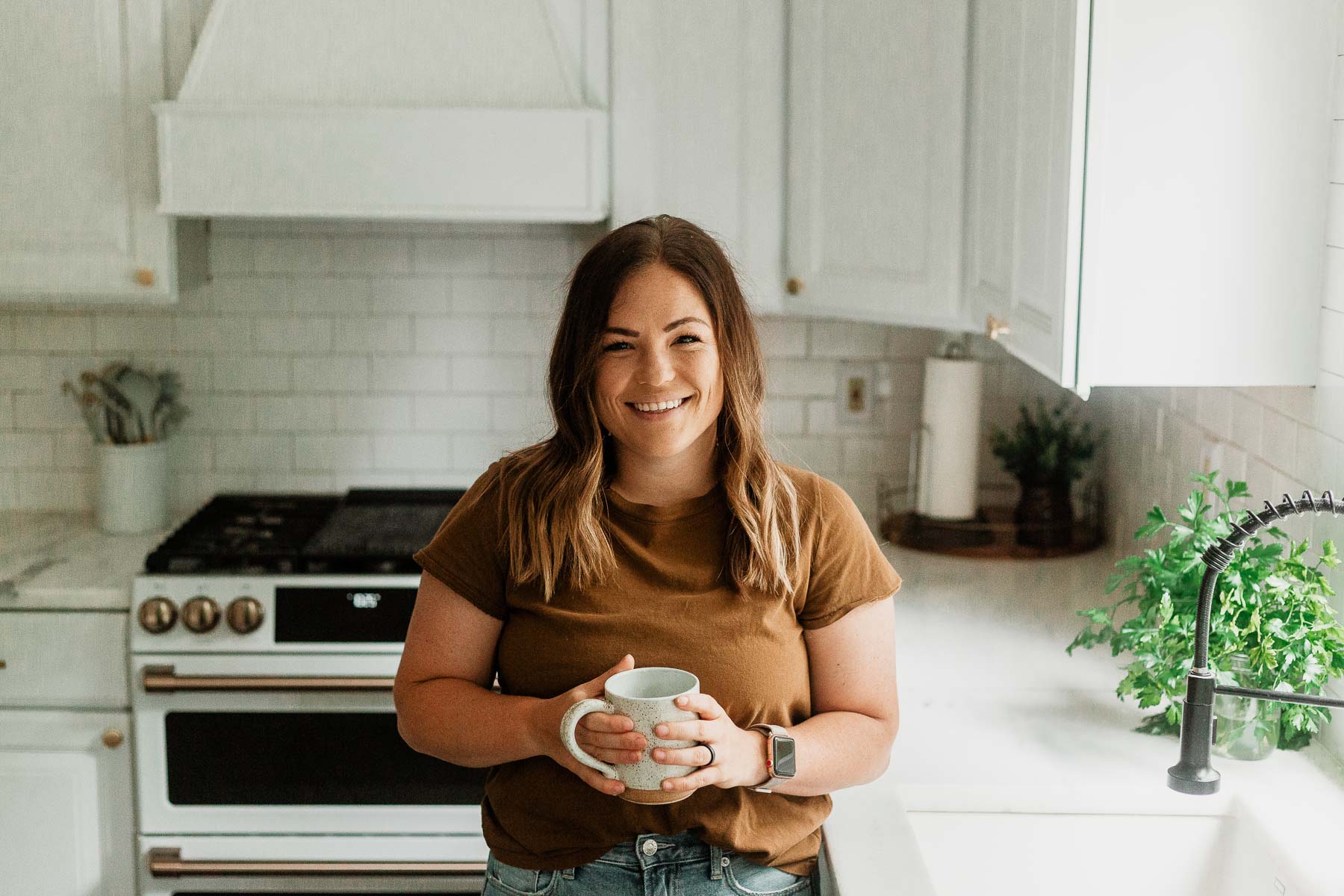 molly thompson in the kitchen with a coffee mug