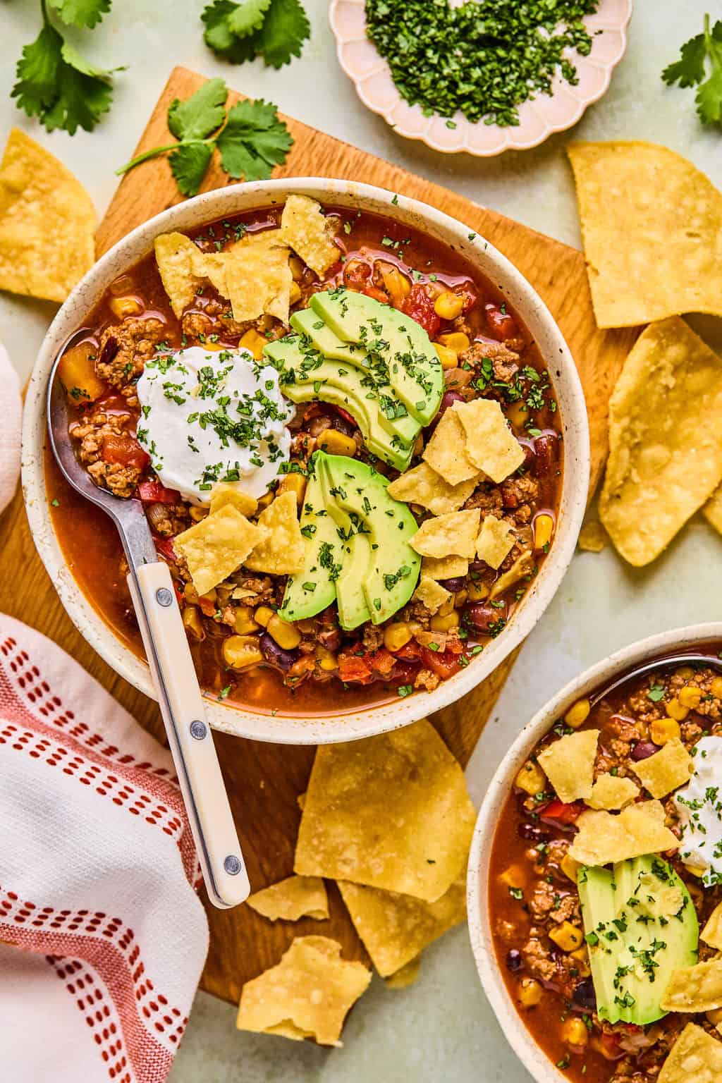 two bowls of taco soup on a counter.