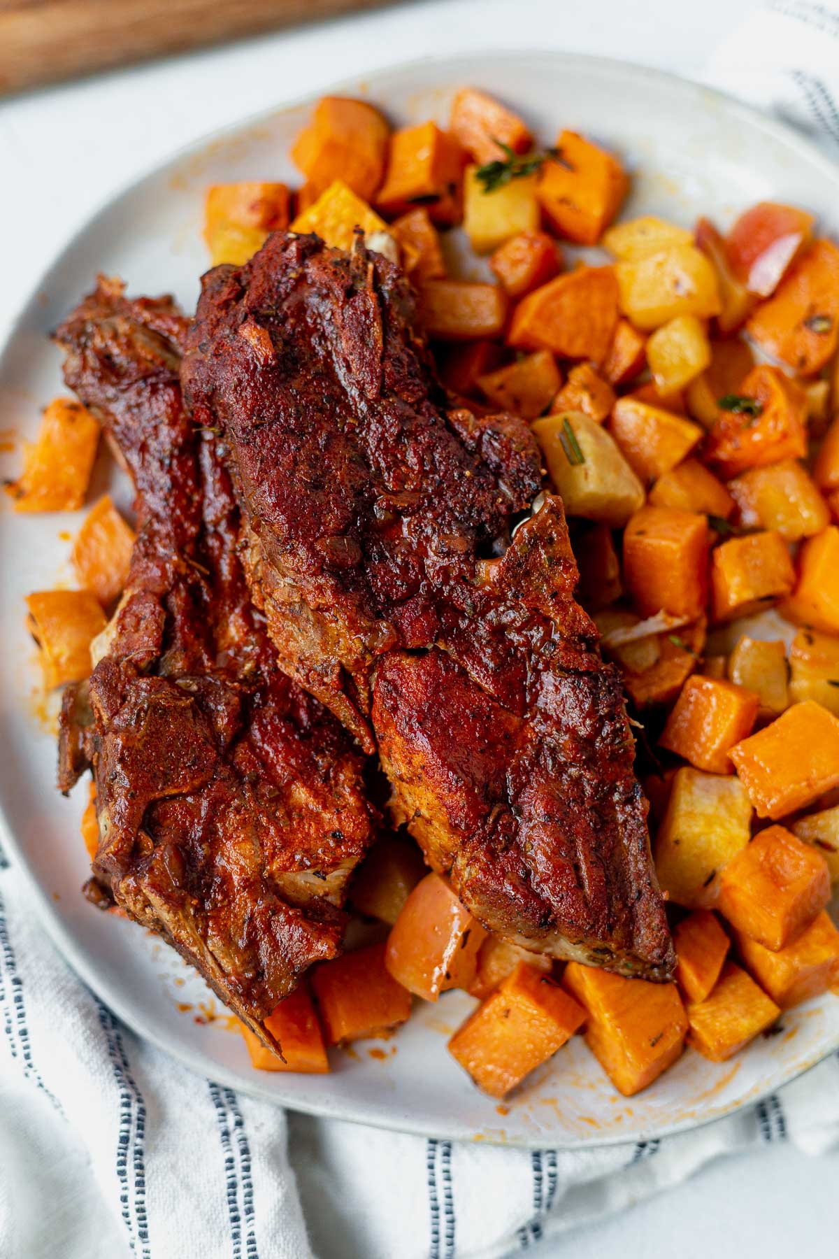 two instant pot country style ribs served with sweet potatoes