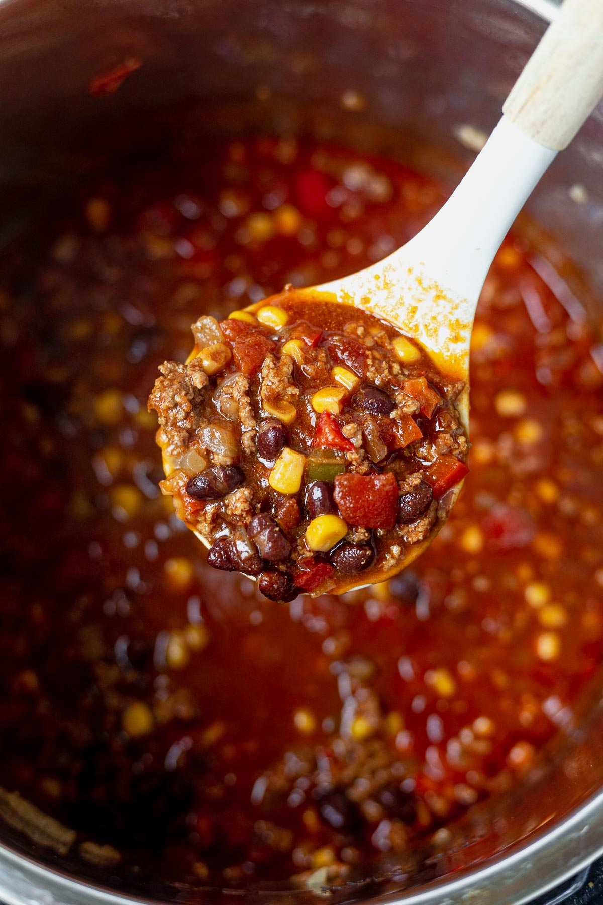a ladle scooping taco soup out of the instant pot