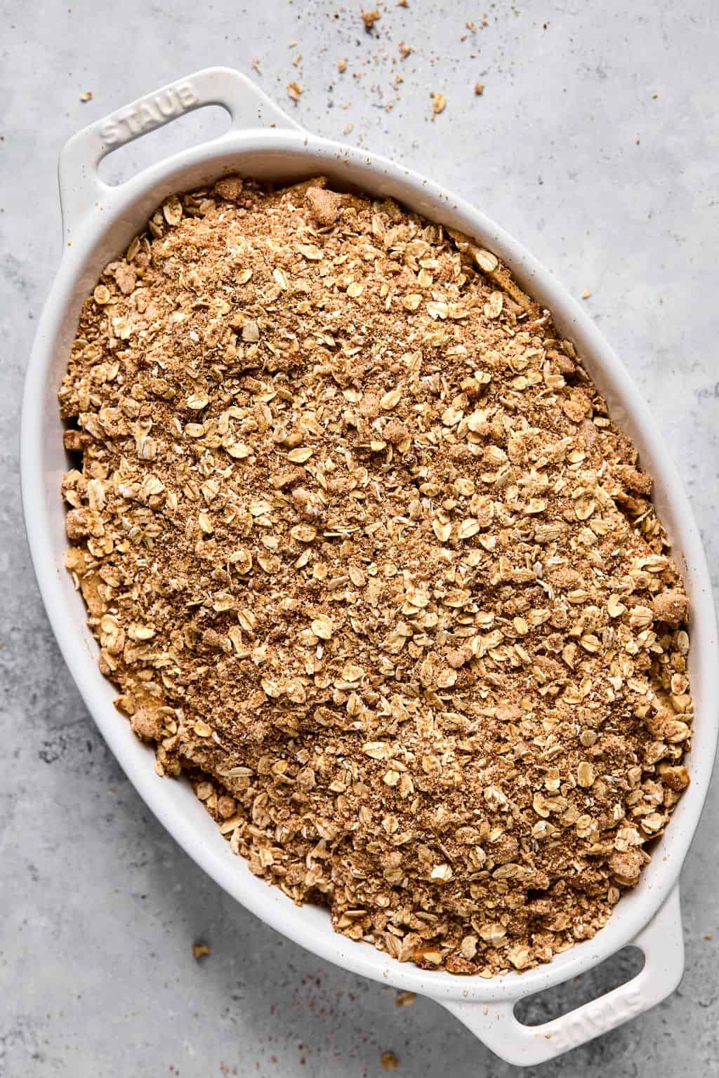 unbaked apple crisp in a casserole dish.