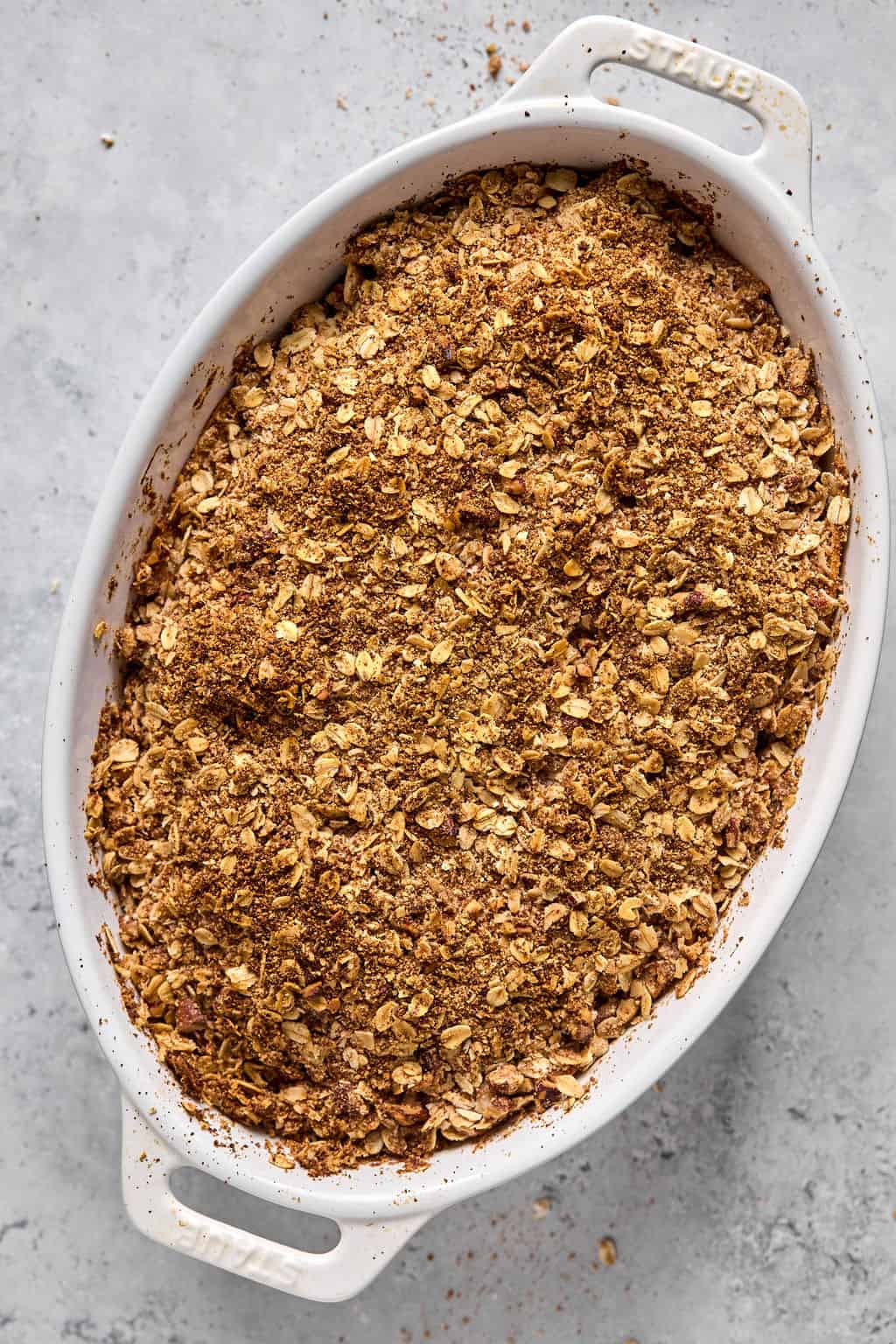 baked healthy apple crisp cooling on a counter.