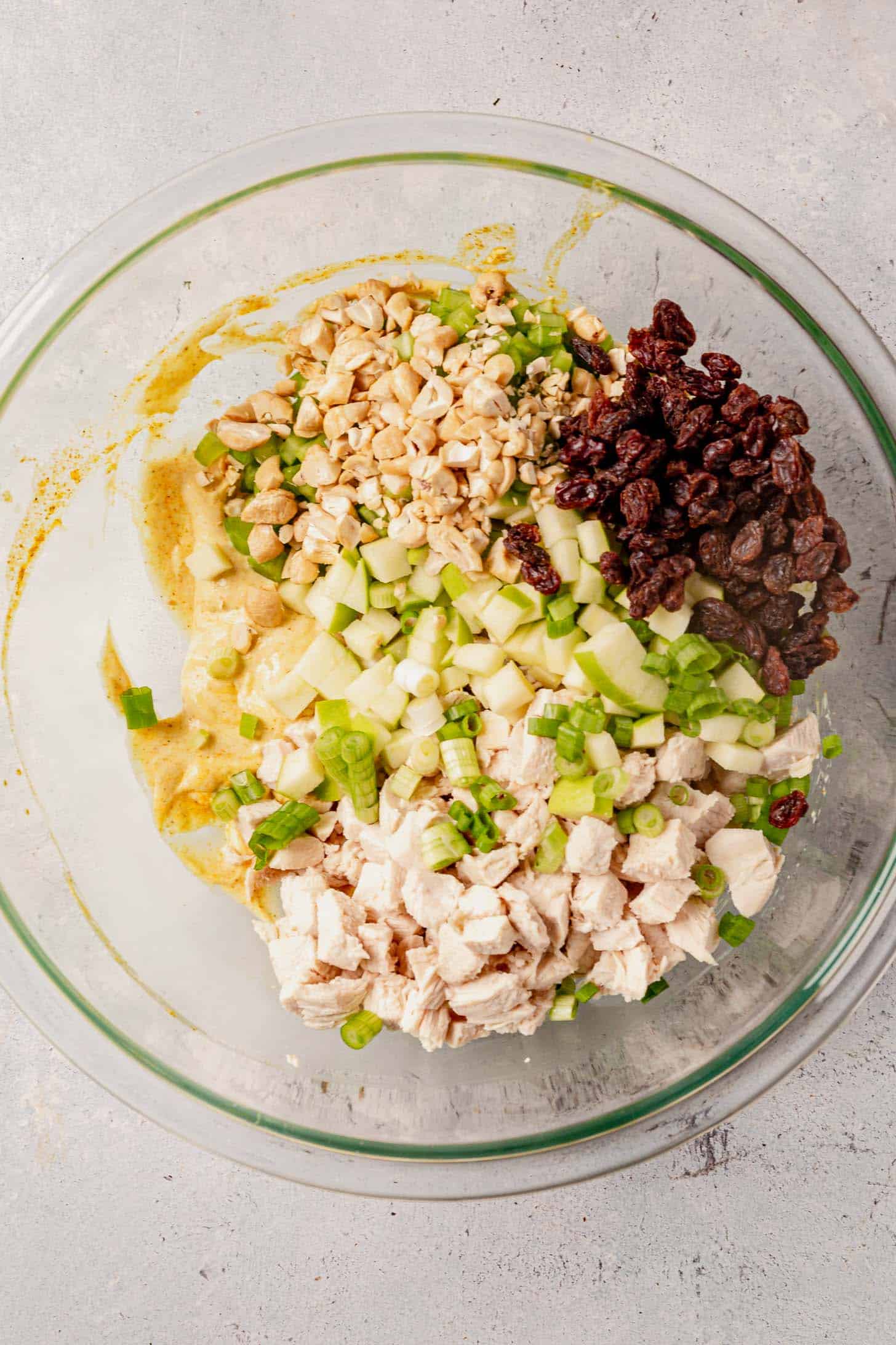 curry chicken salad ingredients in a large bowl