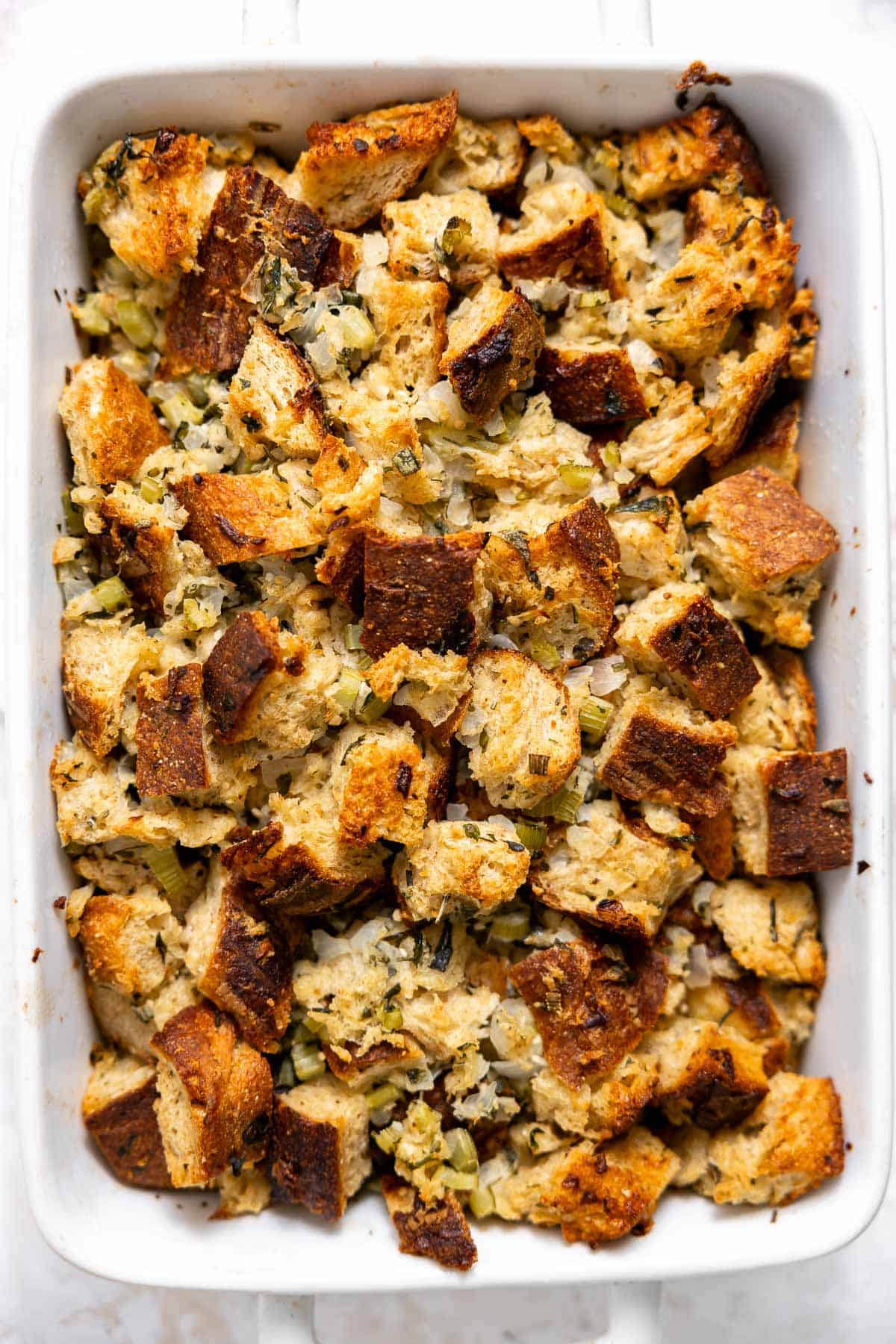 sourdough stuffing cooling in a casserole dish.