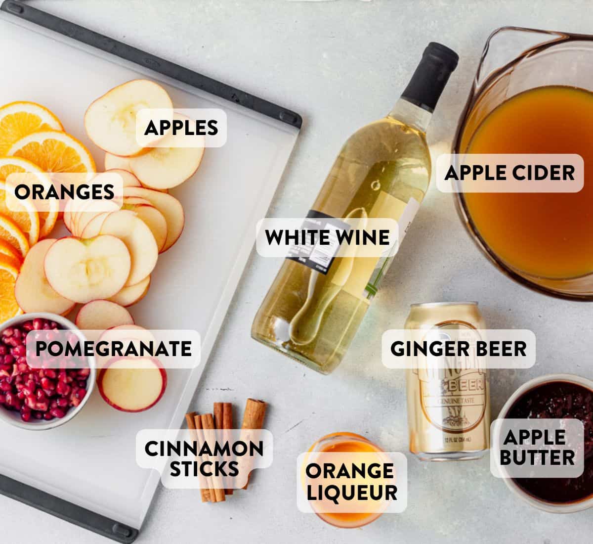 apple cider sangria ingredients on a countertop.