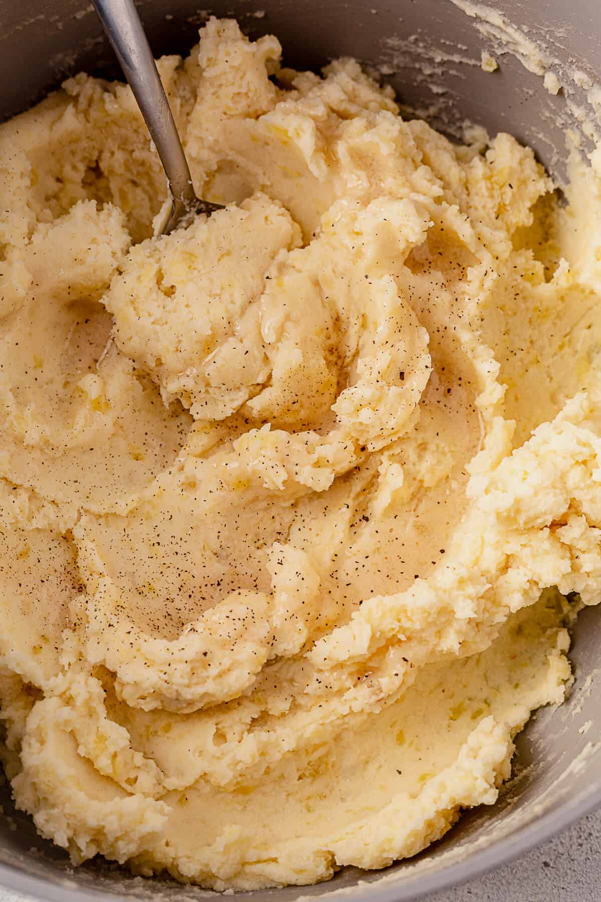 a spoon scooping out dairy-free mashed potatoes