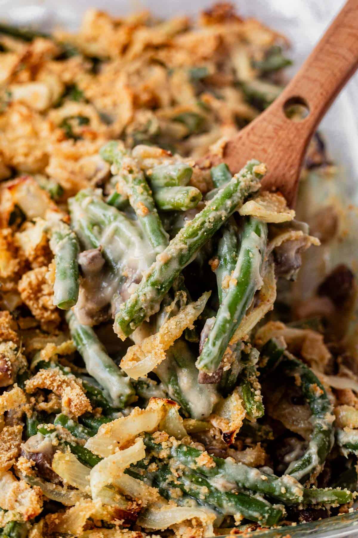 gluten free dairy free green bean casserole on a serving spoon.