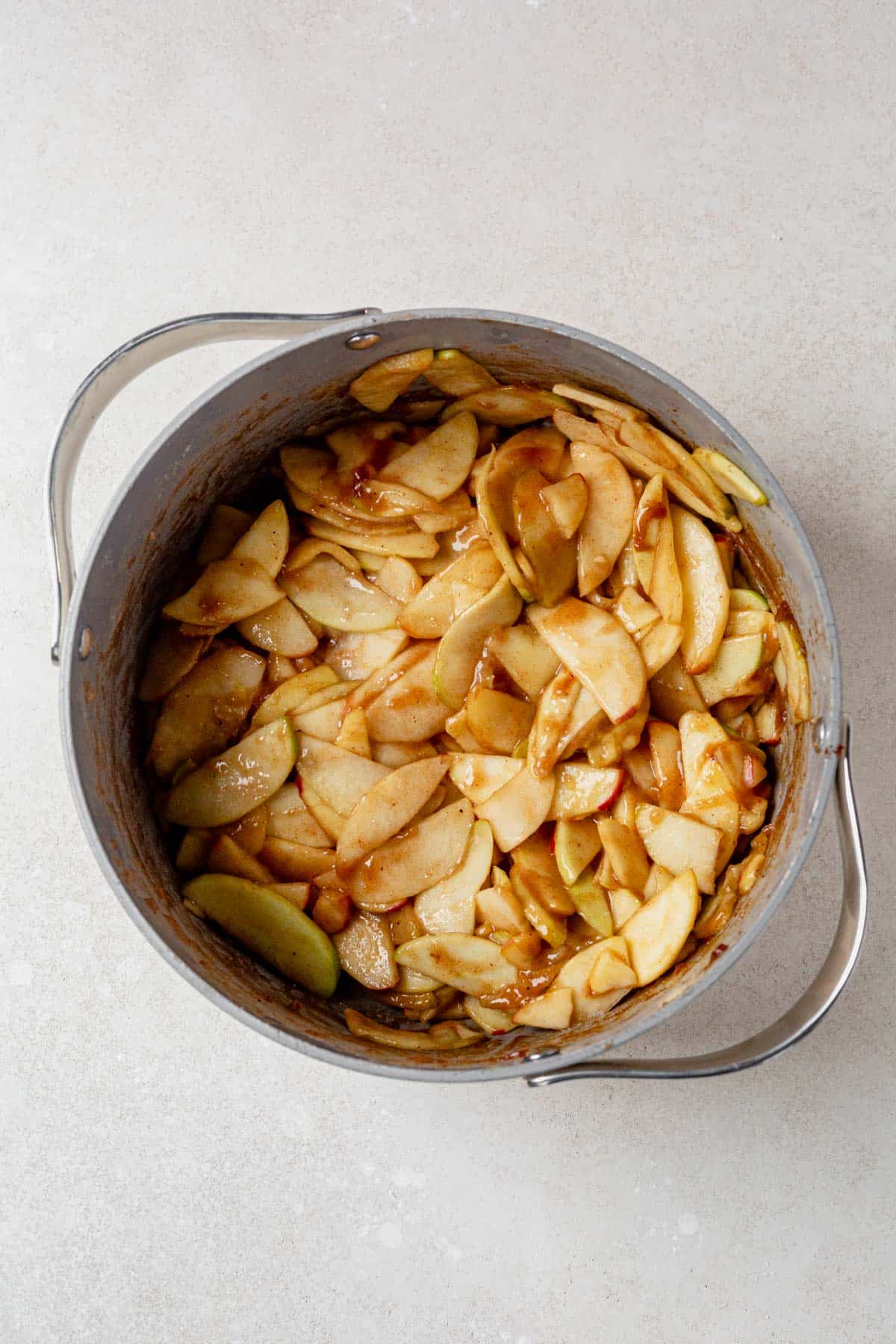 pre cooked apple pie filling in a large dutch oven.