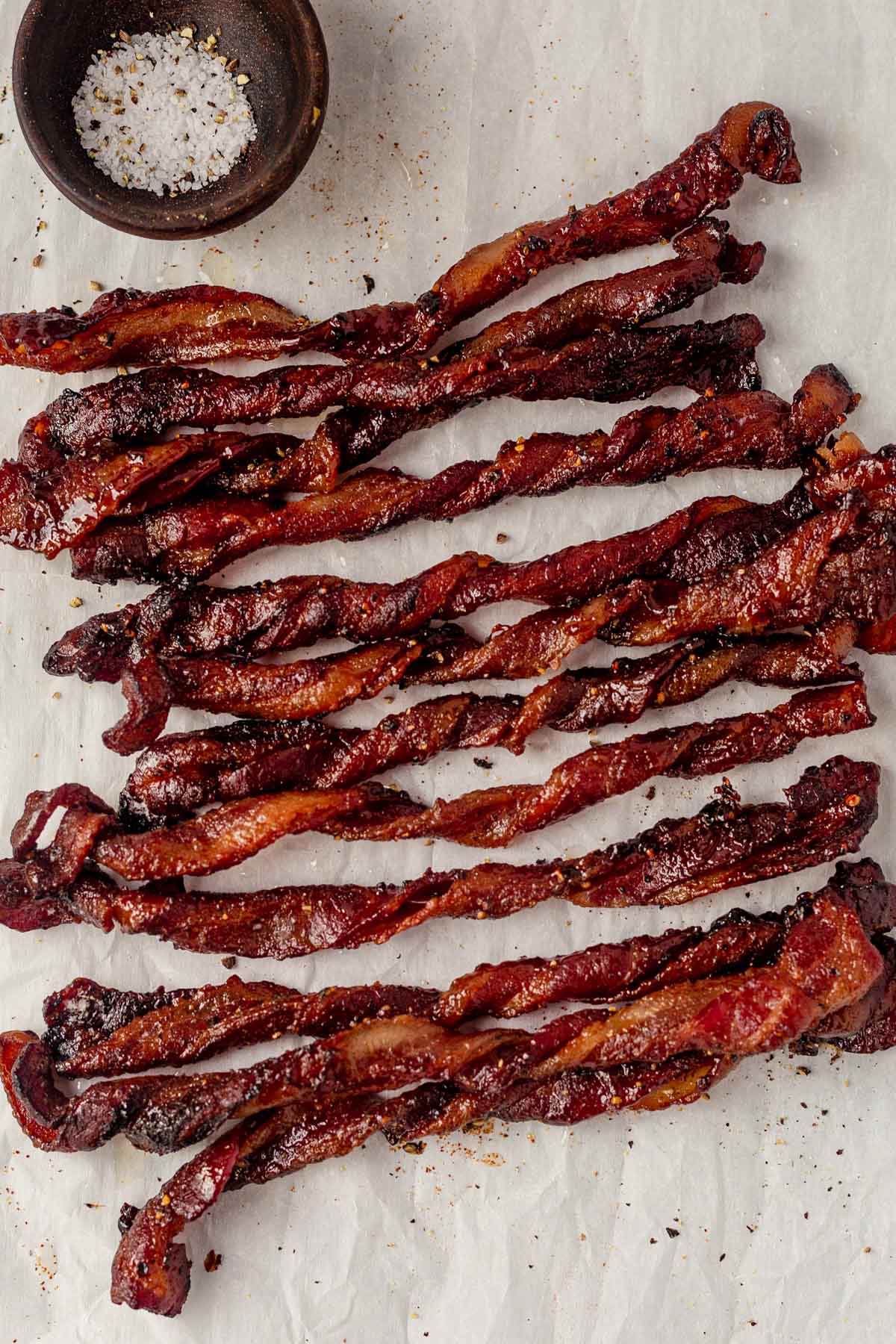twisted bacon on parchment paper
