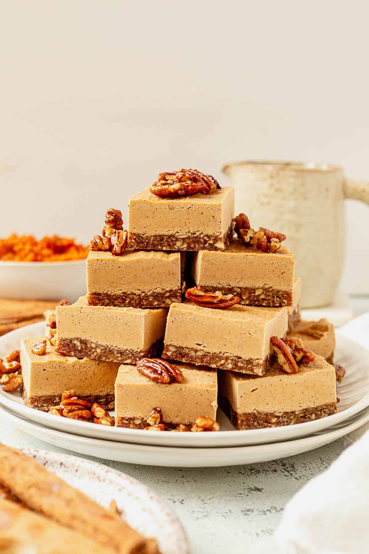 a plate of vegan pumpkin cheesecake bars