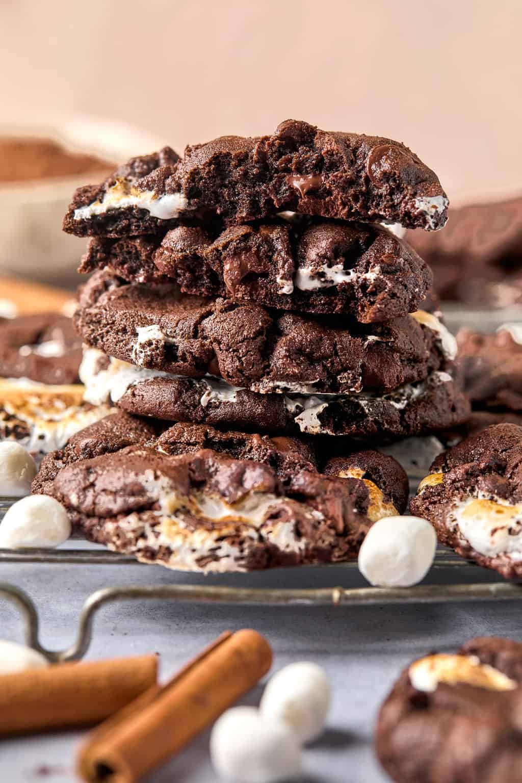 a stack of mexican hot chocolate cookies on a wire rack.