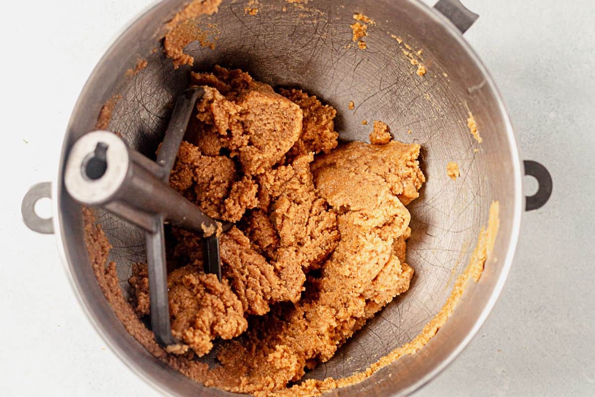 almond flour peanut butter cookie dough in a stand mixer with the paddle attachment