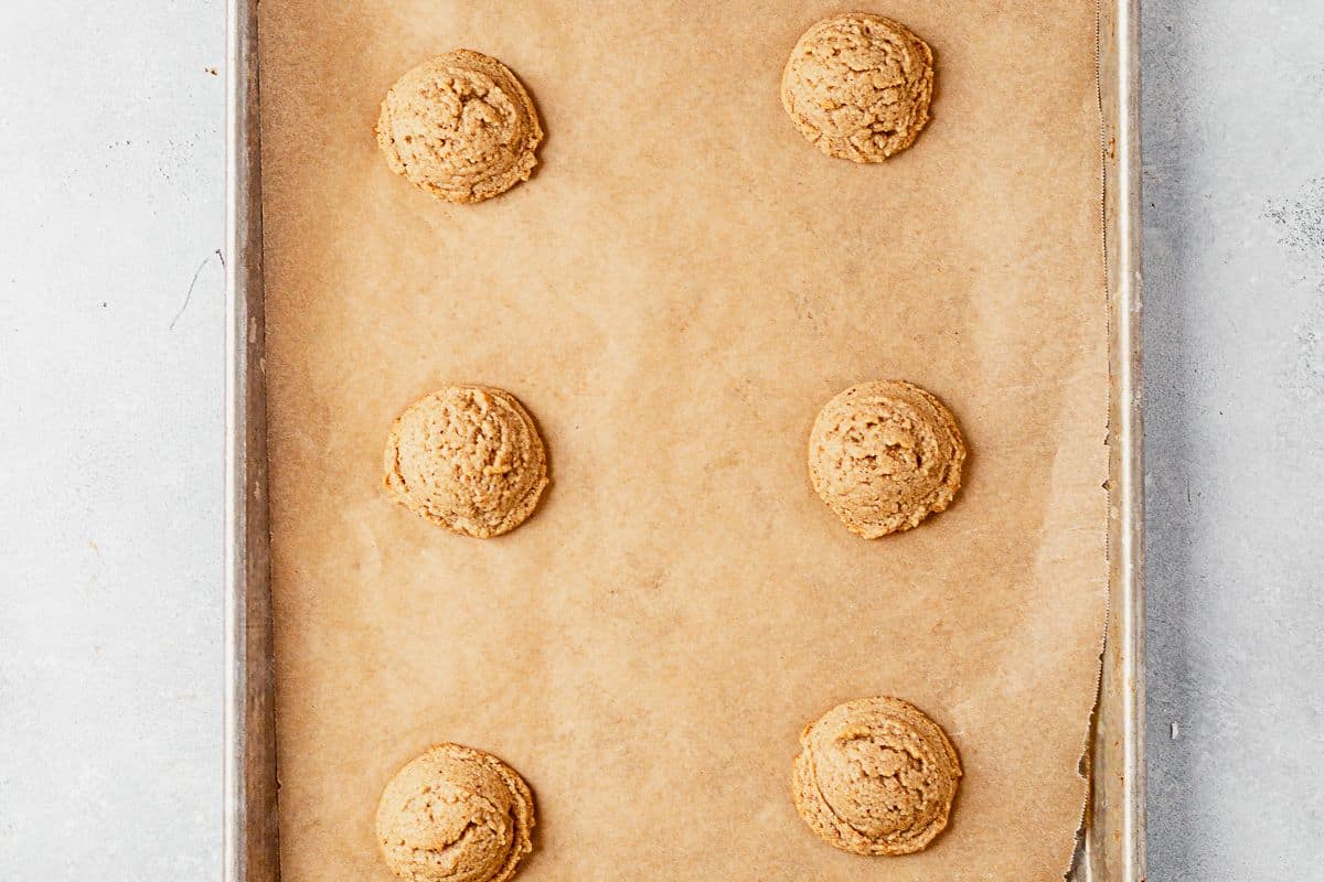freshly baked almond flour peanut butter cookies on a cookie sheet
