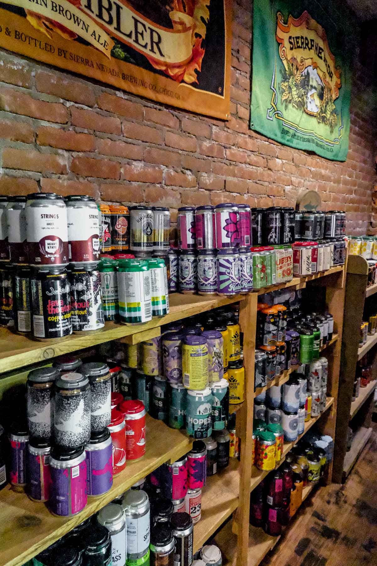 shelf stacked with custom beer in barley hopsters in downtown delaware ohio