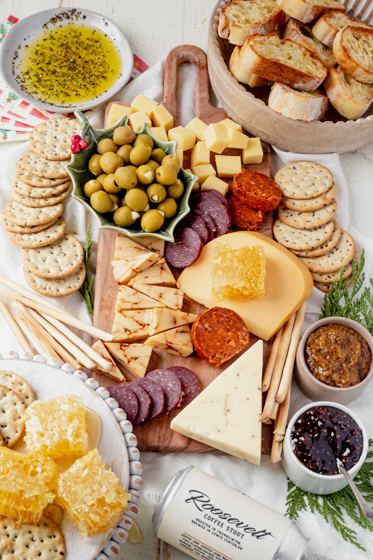 a full charcuterie spread on a wooden cutting board with products from downtown delaware ohio