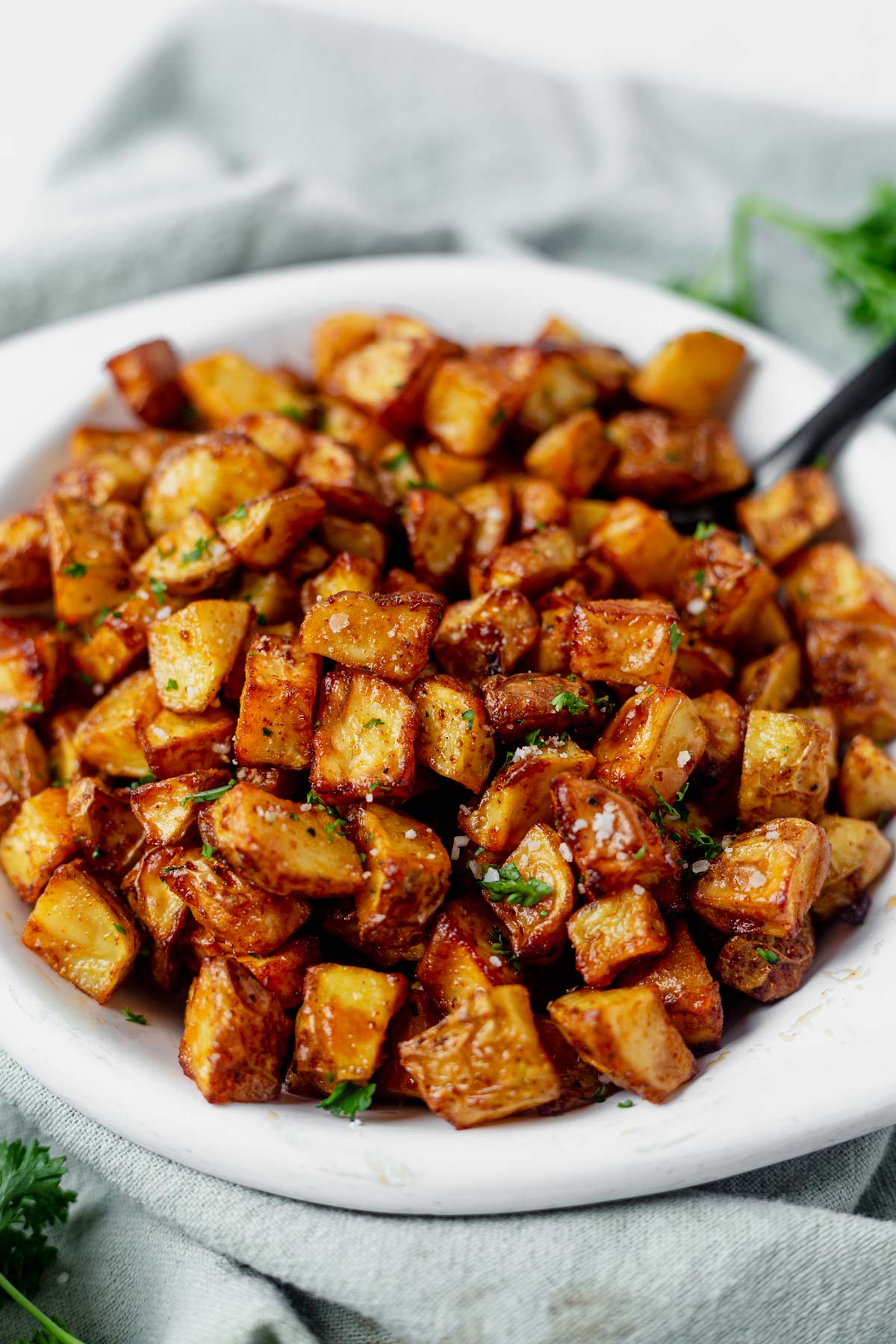 air fryer breakfast potatoes topped with fresh parsley