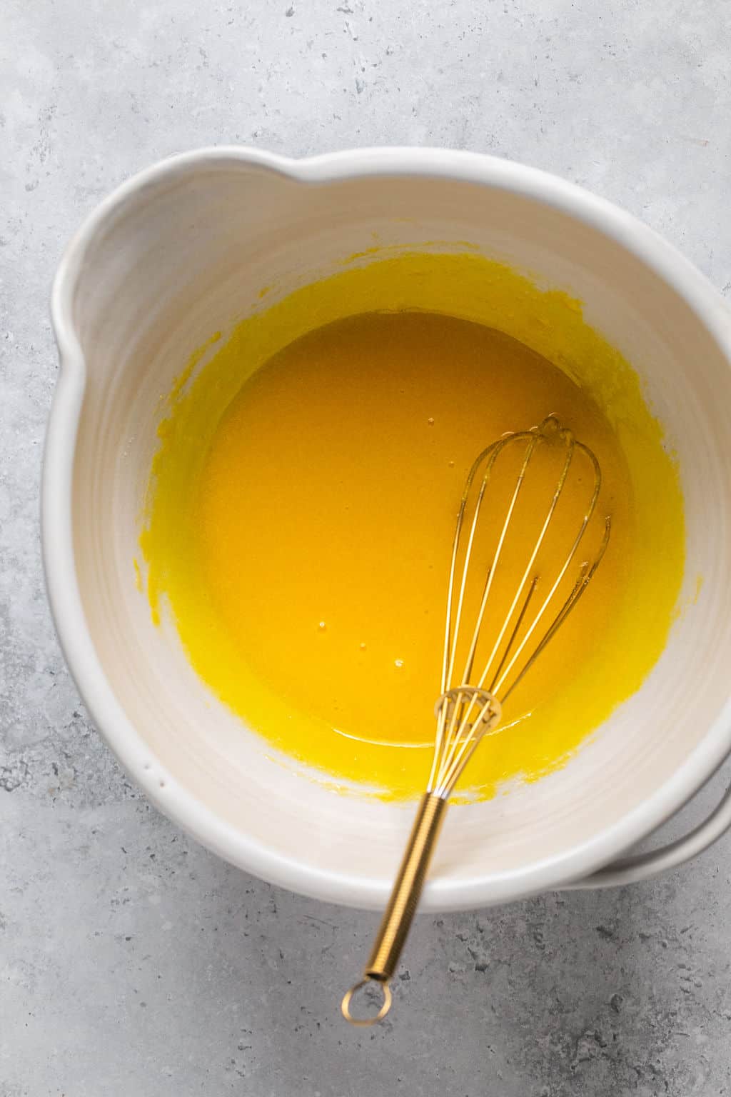 egg yolks and sugar whisked in a mixing bowl.