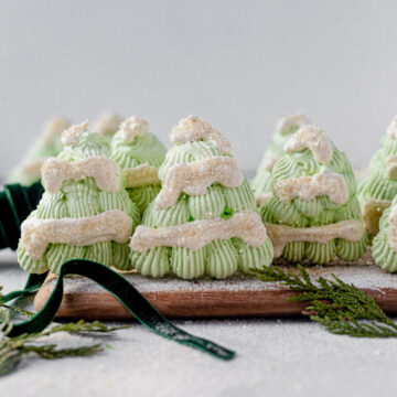 light green meringue christmas trees with snow caps and sprinkles