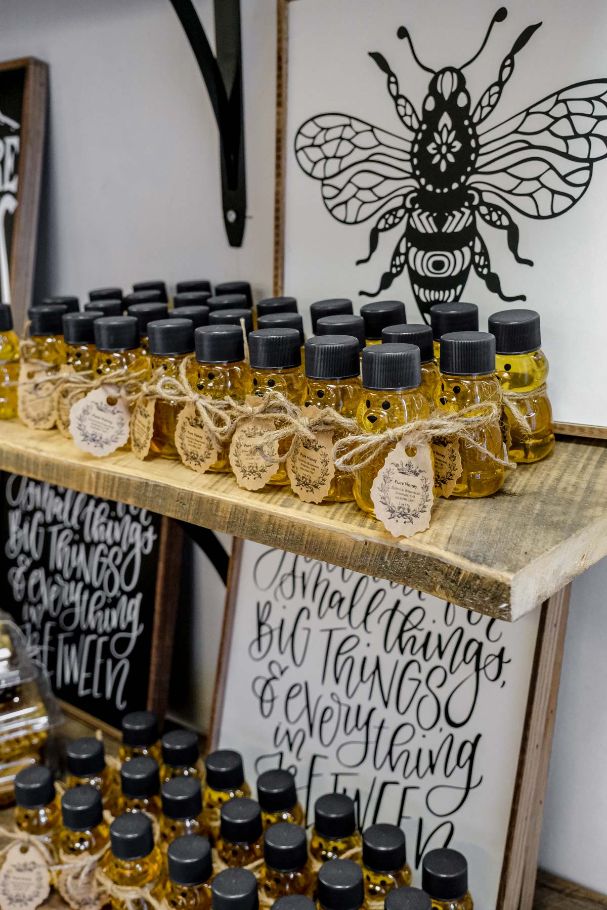 a wall full of fresh local honey in bottles