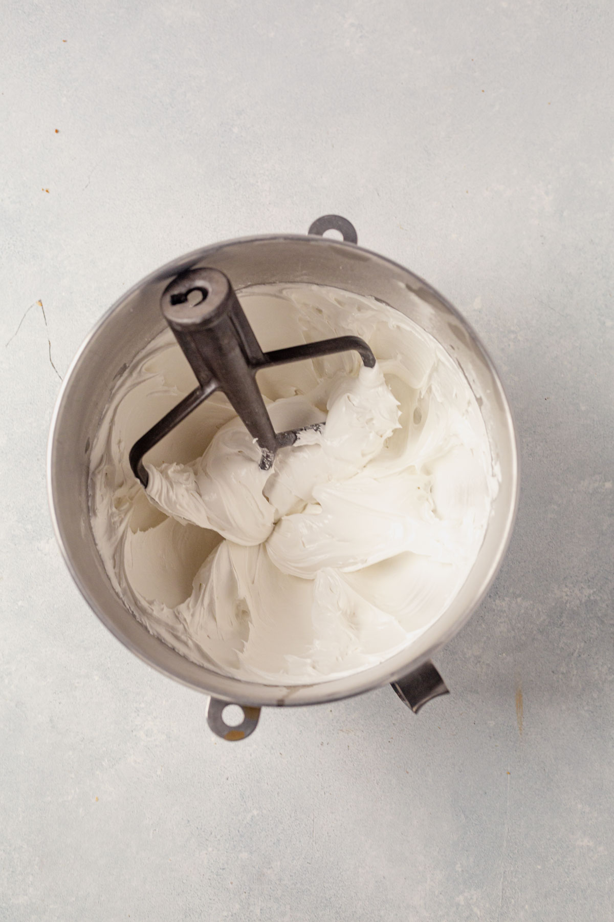 meringue beaten to stiff peaks in a stand mixer