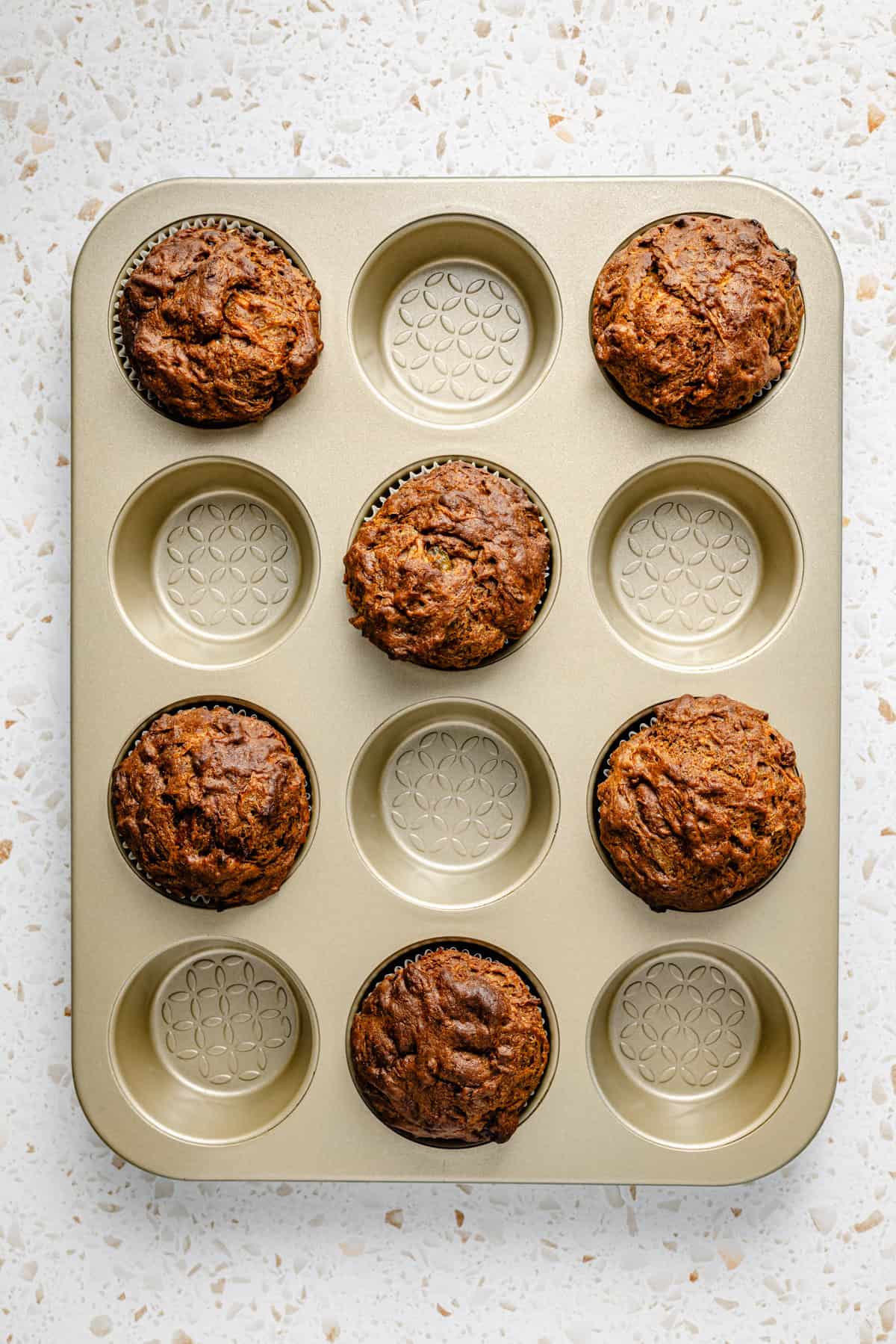 gluten free morning glory muffins baked in a muffin tin.