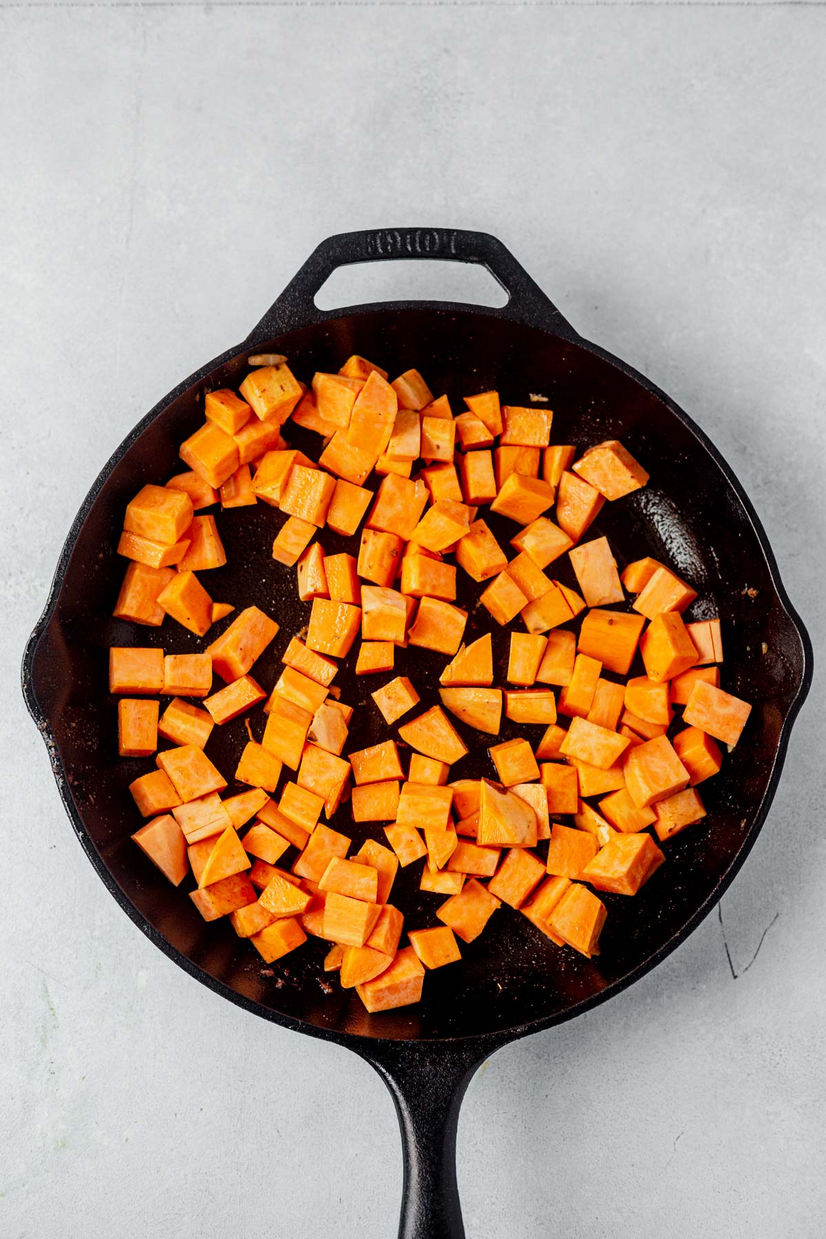 diced sweet potoatoes in a skillet