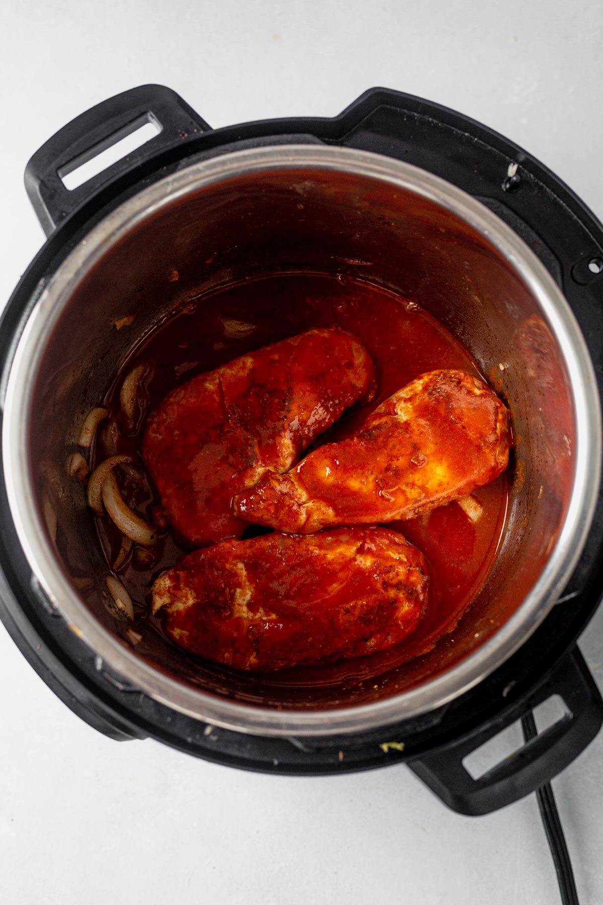 chicken breast in the Instant Pot with enchilada sauce