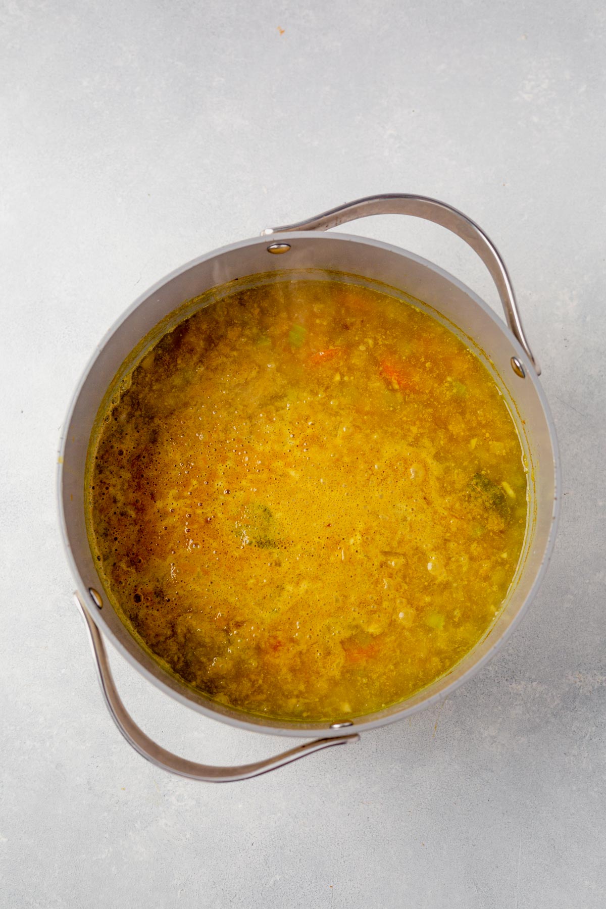 lemon lentil soup cooking in a stock pot