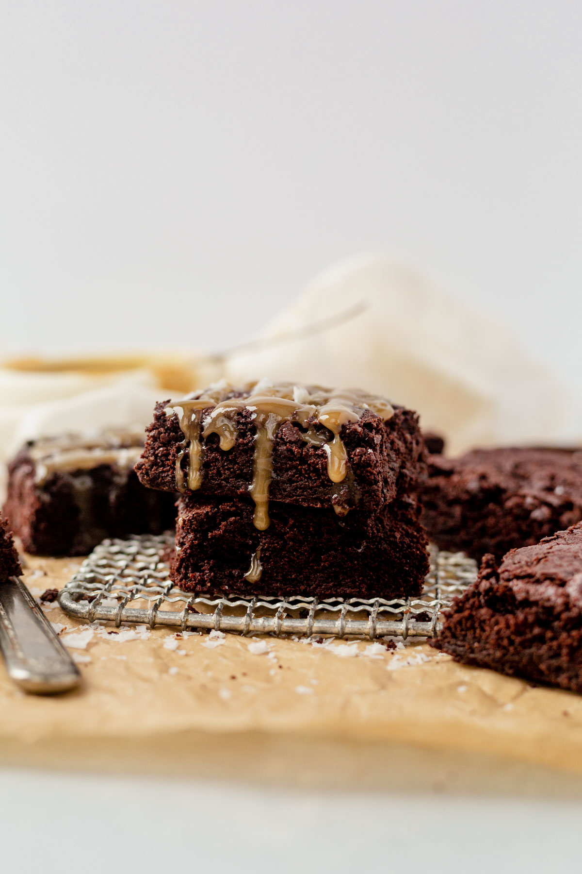 chocolate tahini brownies on a piece of parchment paper