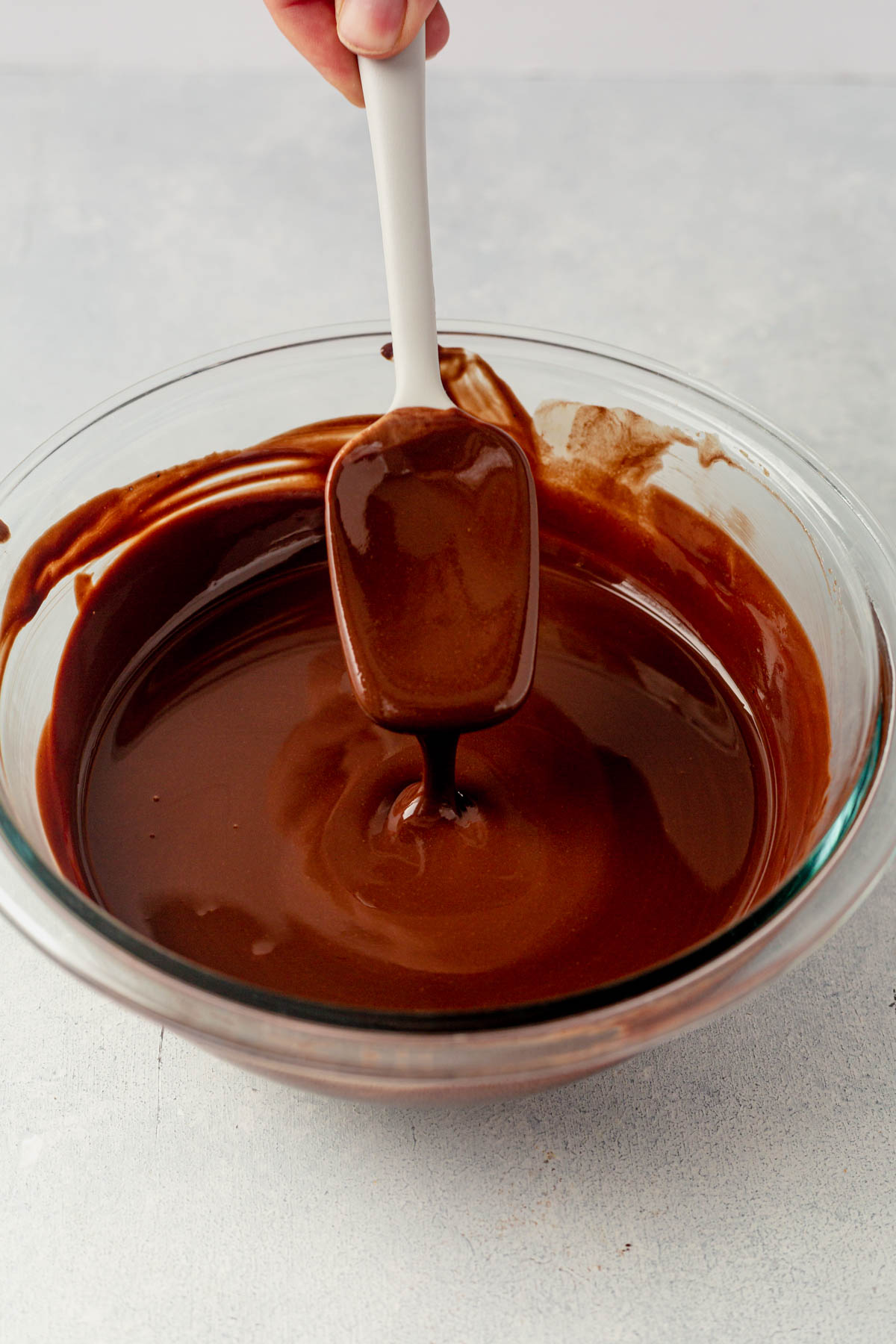 melted chocolate and tahini in a glass bowl