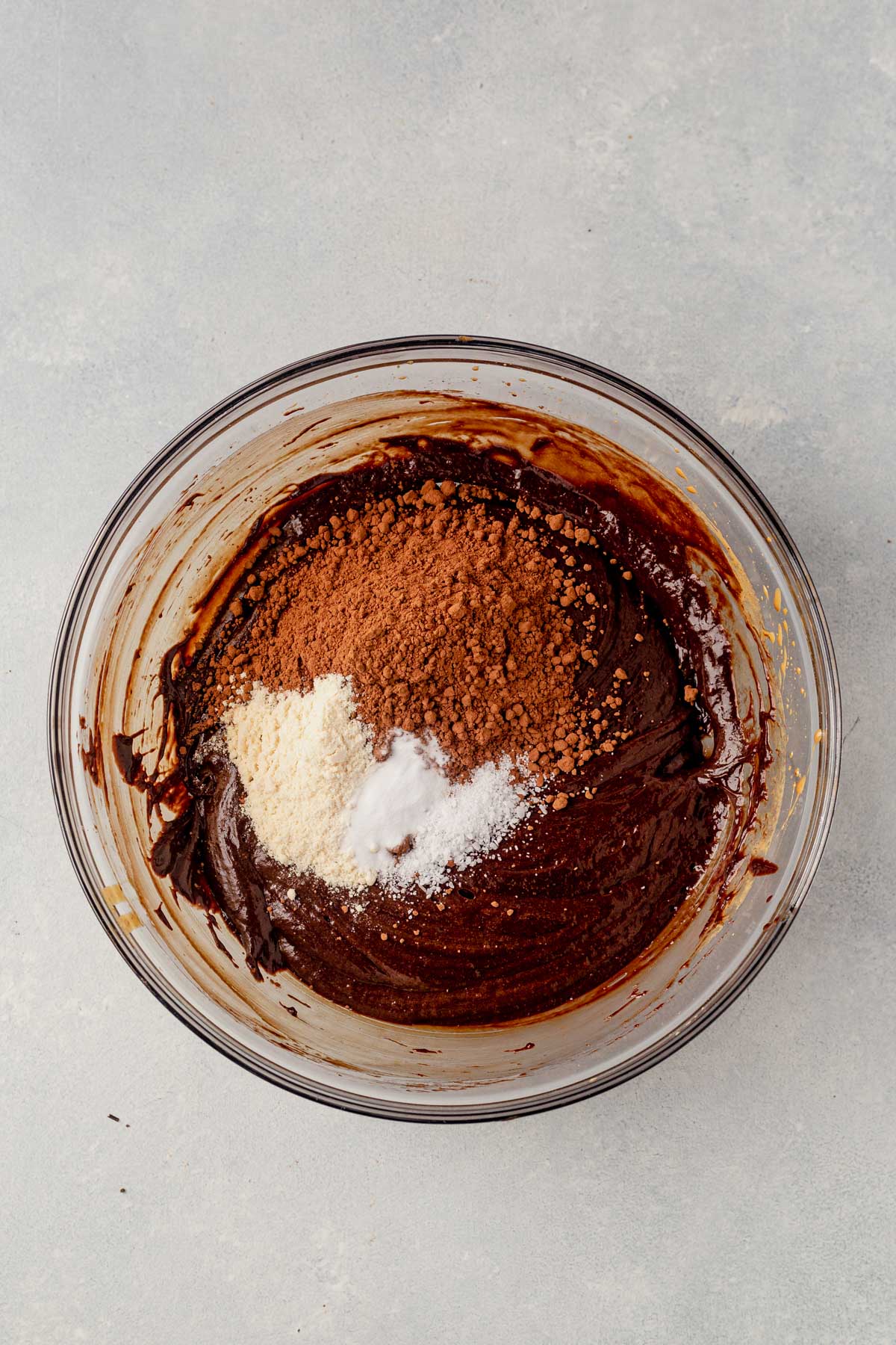 chocolate tahini brownie batter with dry ingredients before mixing