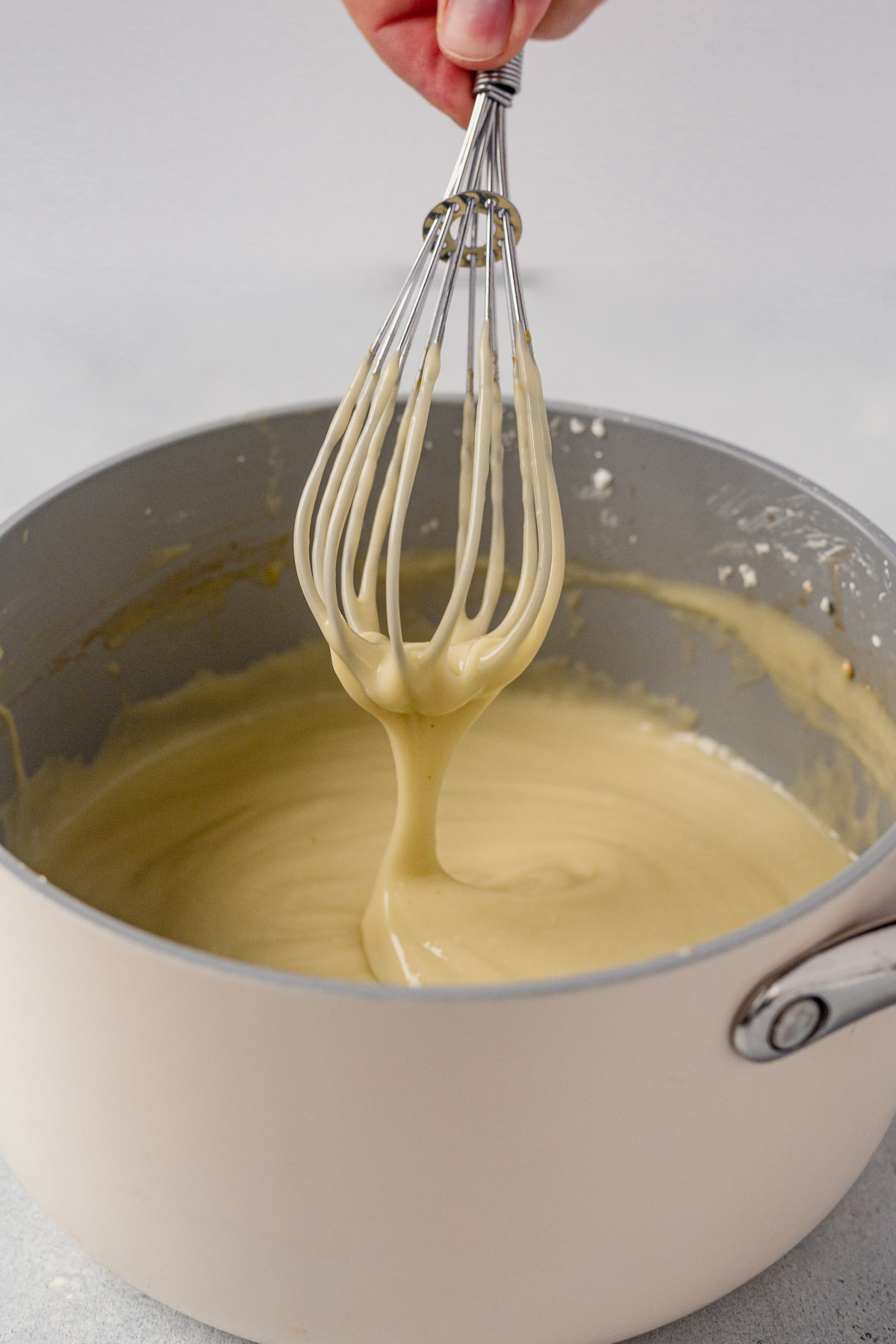 vegan vanilla pudding whisking in a saucepan
