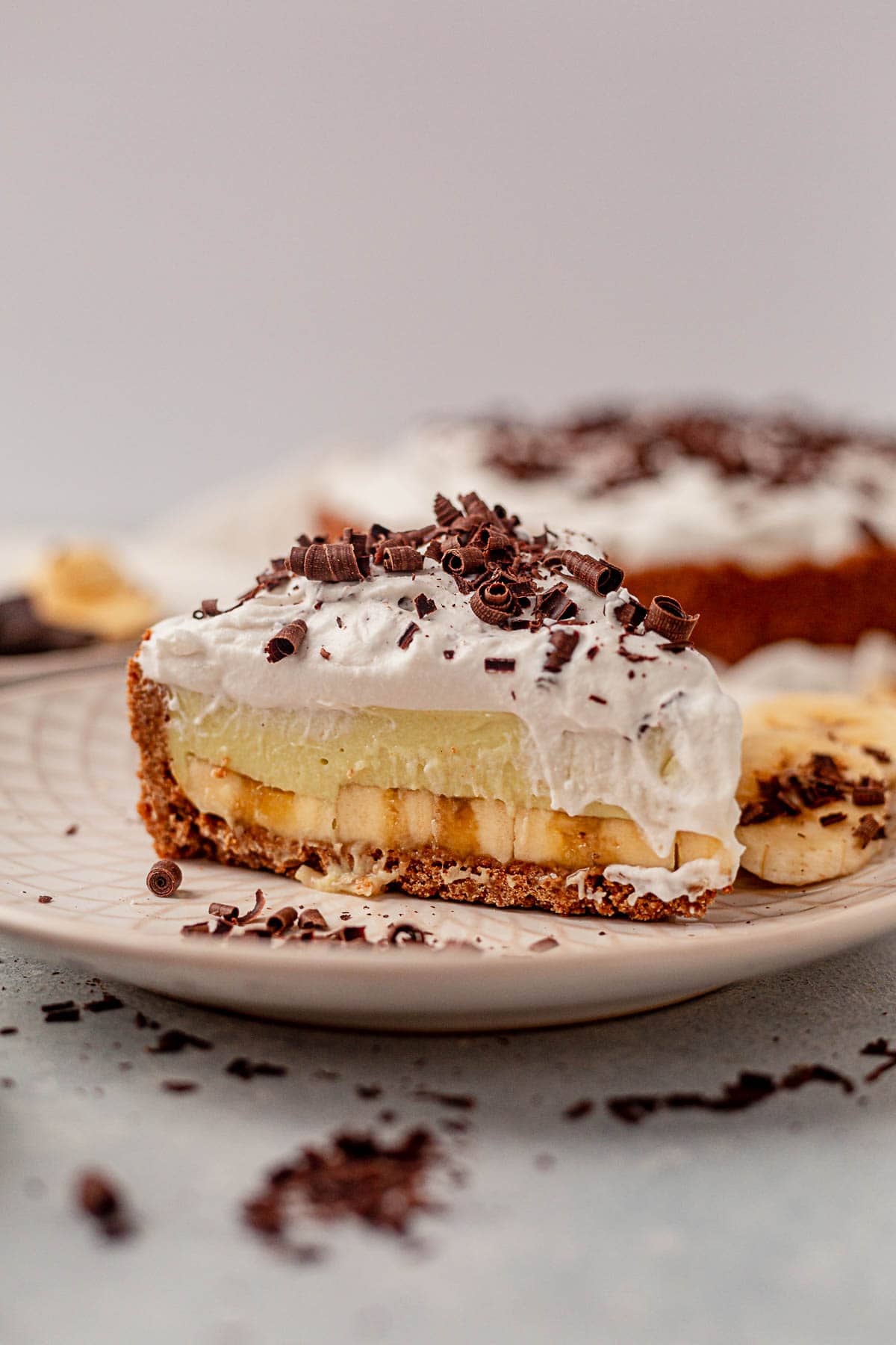 a slice of vegan banana cream pie on a plate