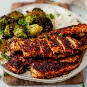 sliced blackened chicken tenders with rice and broccoli