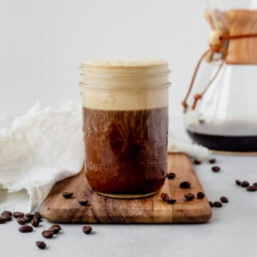 cold brew coffee in a mason jar topped with vanilla sweet cream cold foam
