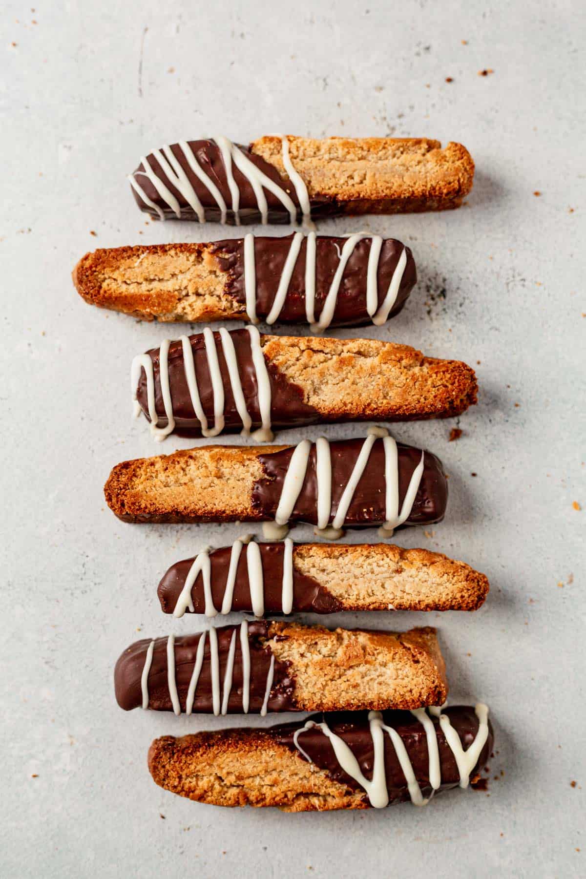 almond flour gluten free biscotti dipped in chocolate on a plate