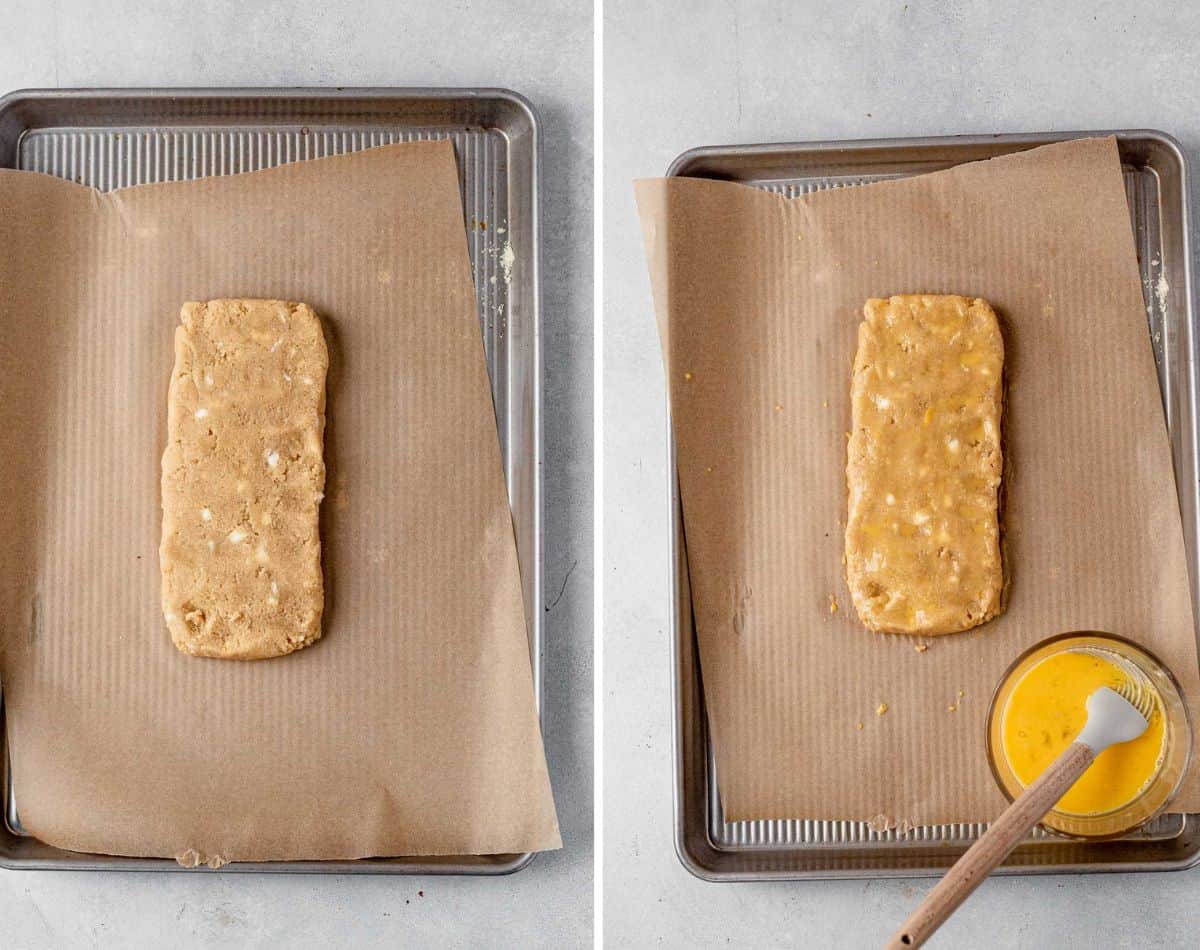gluten free biscotti dough on a baking sheet with egg wash