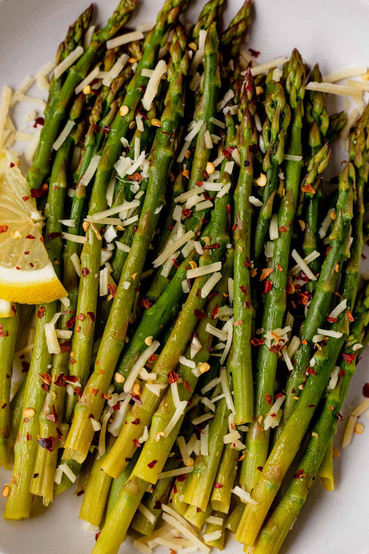 close up of tender asparagus cooked in the Instant Pot with fresh lemon and olive oil