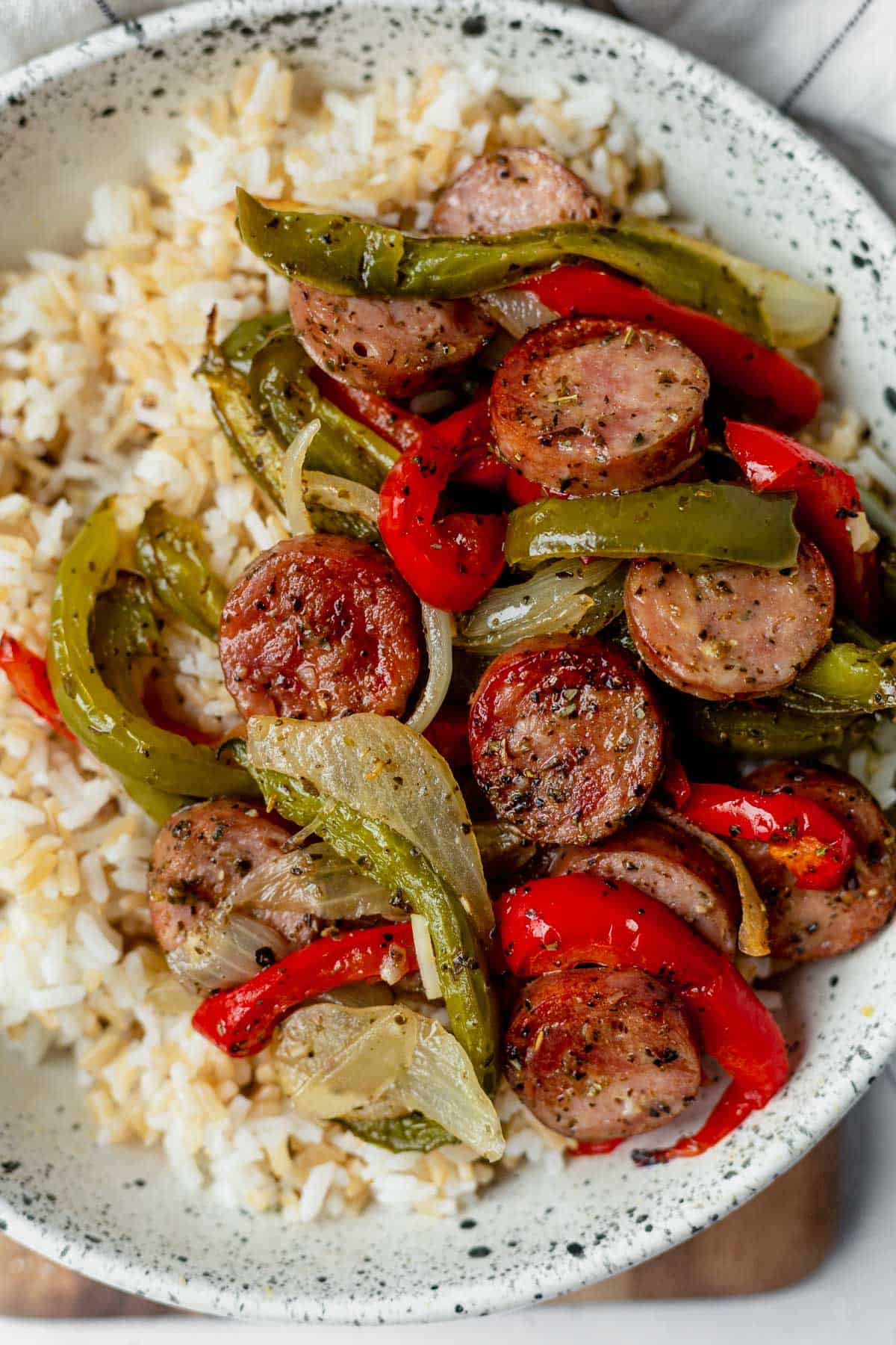 sausage and peppers over brown rice