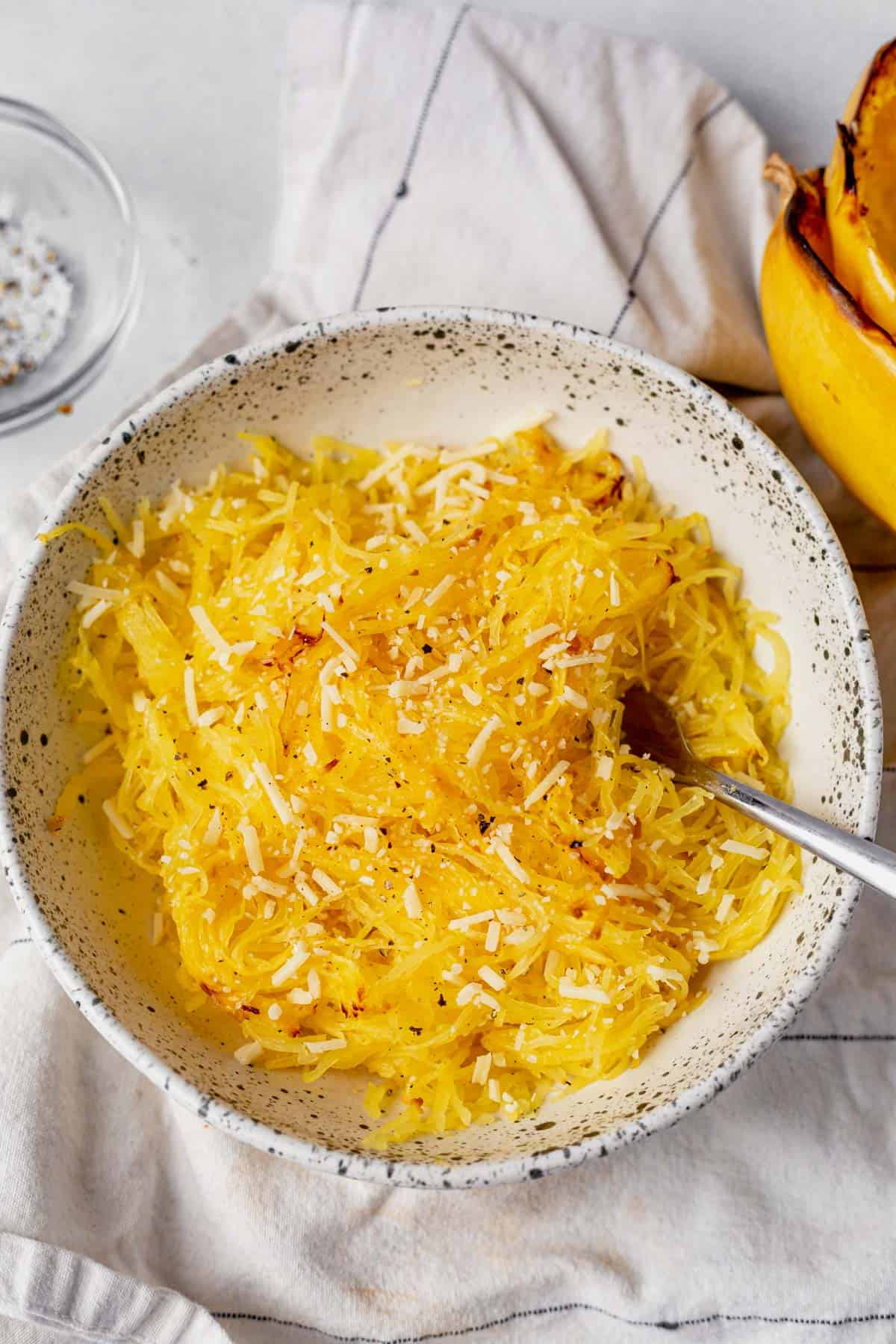 air fryer spaghetti squash in a bowl with parmesan cheese