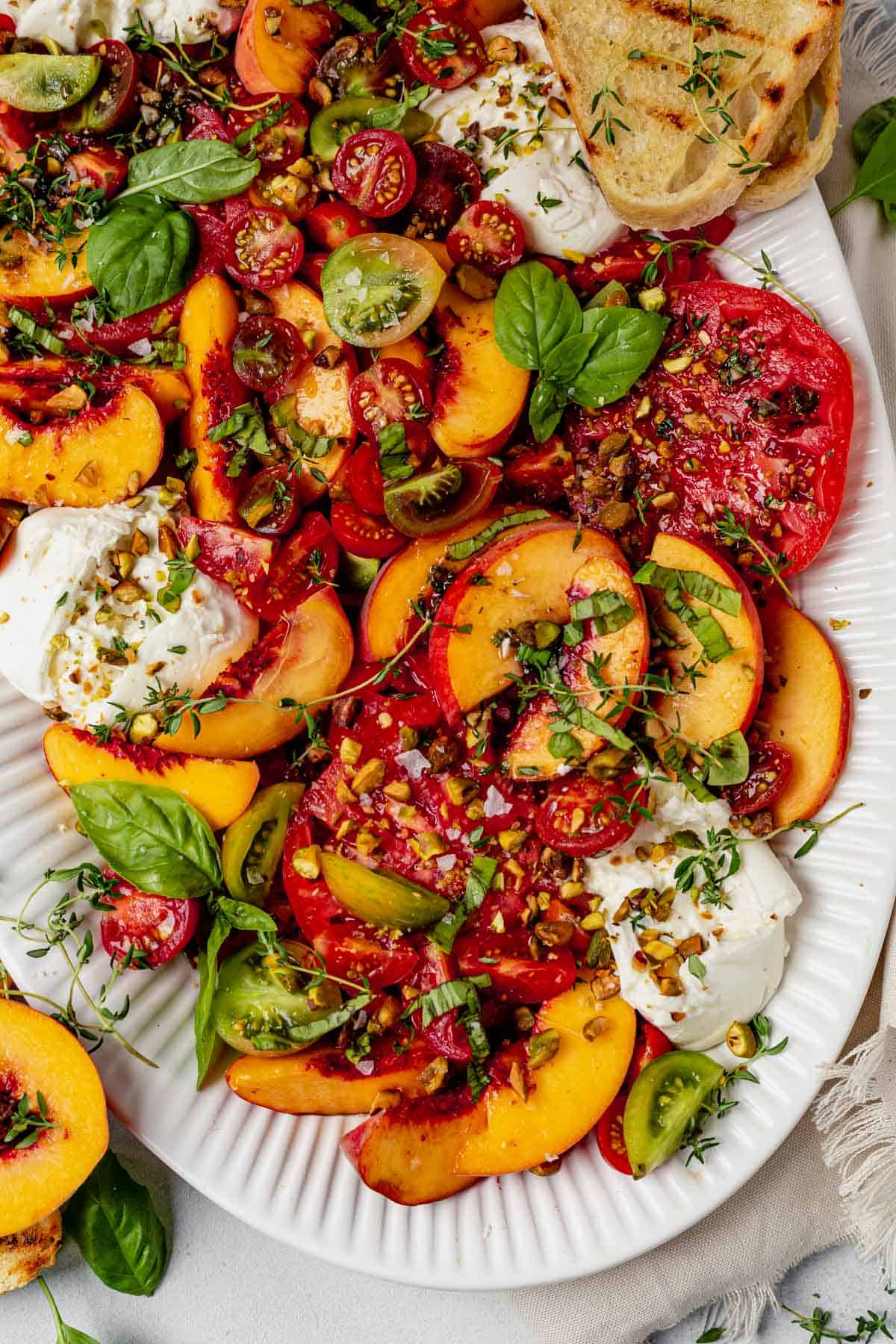 peach and burrata salad with crusty bread