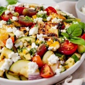 grilled zucchini salad in a serving bowl