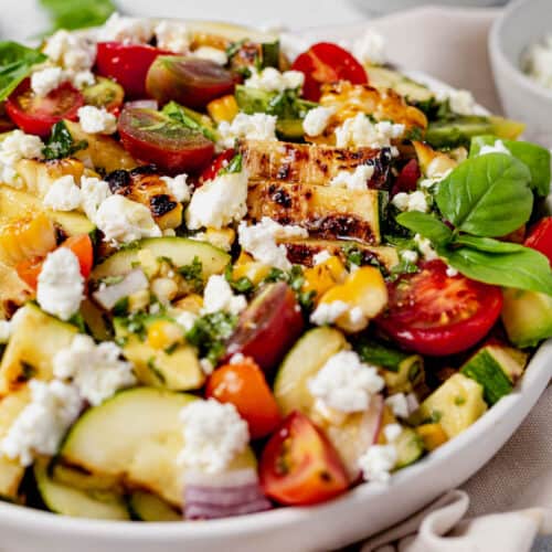 grilled zucchini salad in a serving bowl