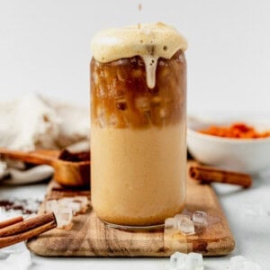 iced pumpkin spice latte on a countertop.