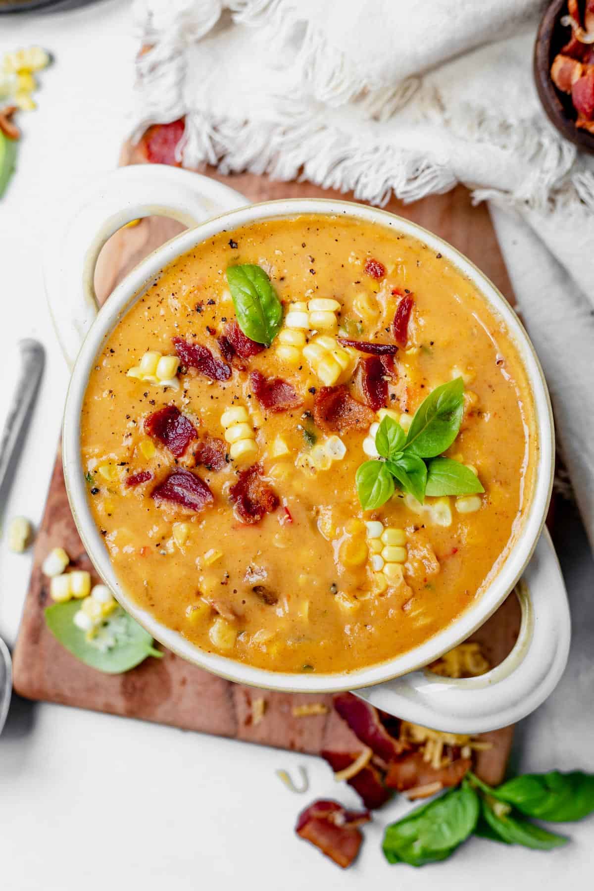 instant pot corn chowder in a bowl with fresh basil