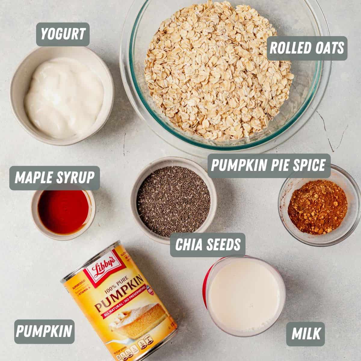 pumpkin pie spice, pumpkin, chia seeds, oats, milk and yogurt measured on a table